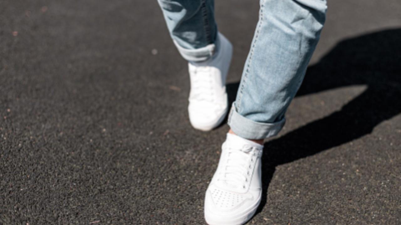 Pair white or black sneakers with casual jeans and a T-shirt. For a more defined look, wear a pair of high-top sneakers.