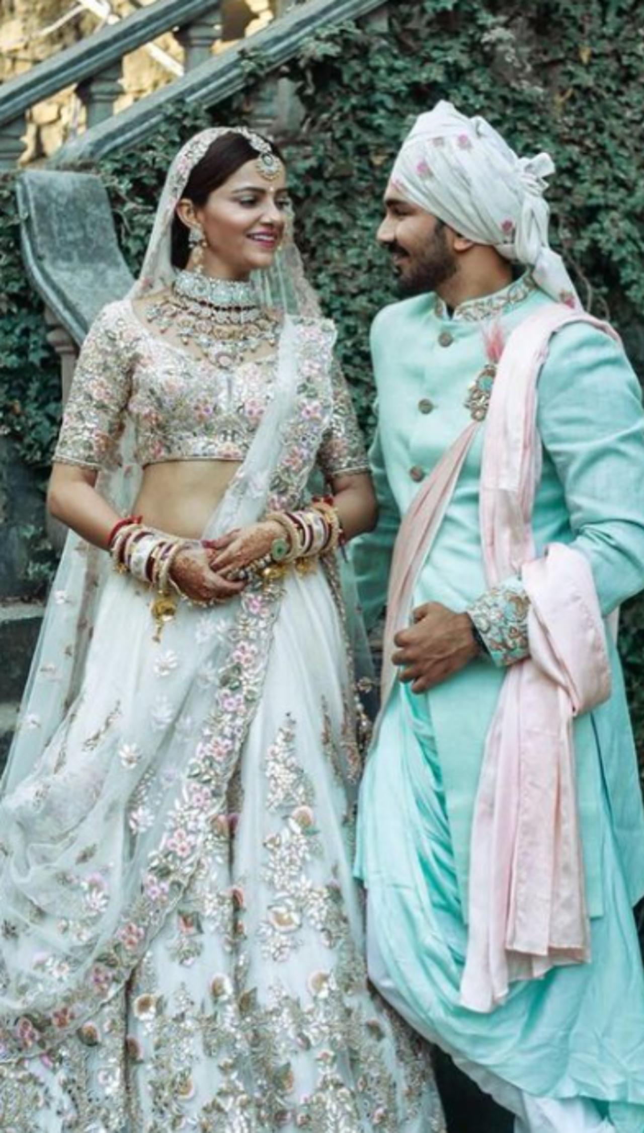 Rubina Dilaik wore a pastel coloured floral embroidered lehenga for her wedding with Abhinav Shukla in her hometown