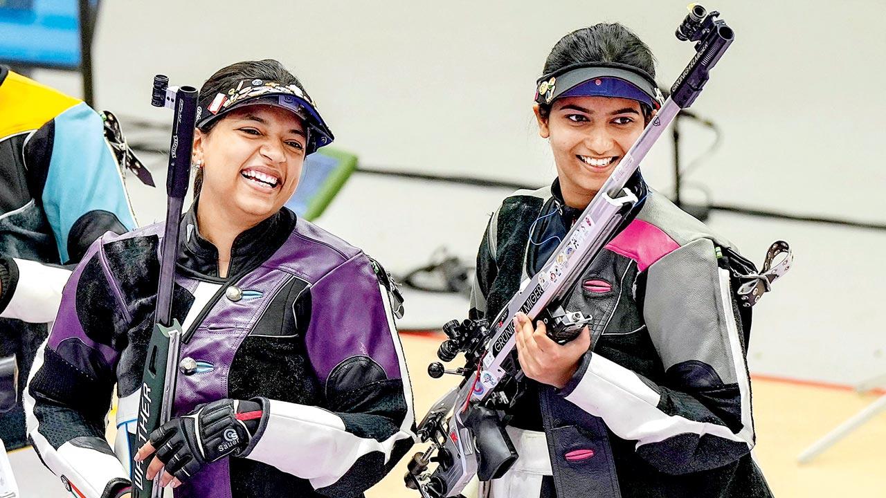 Gold medal-winner shooter Sift Kaur Samra (left) and bronze-medallist Ashi Chouksey after the 50m rifle 3-position final yesterday. Pic/PTI
