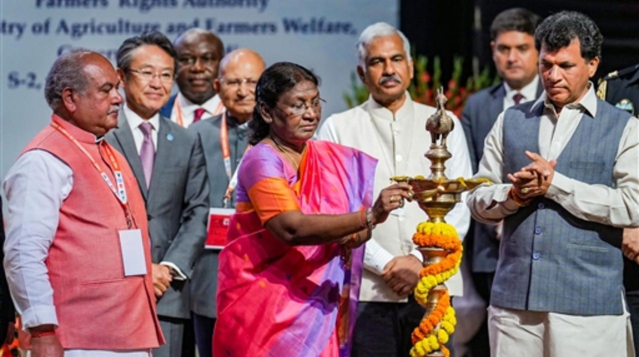 President Droupadi Murmu lights a lamp to inaugurate the Global Symposium on Farmer's Rights, in New Delhi