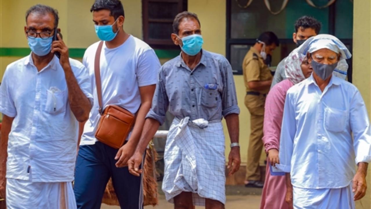 People wear masks at a medical college after the Nipah virus alert, in Kozhikode. Two deaths reported from Kerala's Kozhikode district were caused by Nipah virus