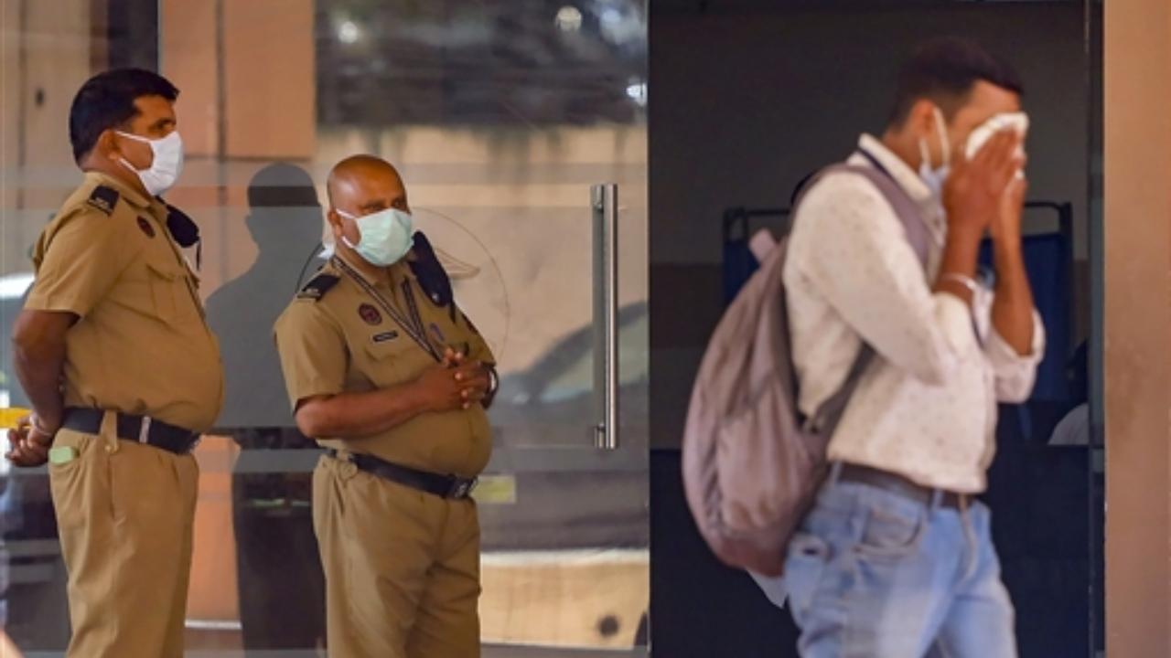 Security personnel keep a vigil at a medical college after the Nipah virus alert, in Kozhikode