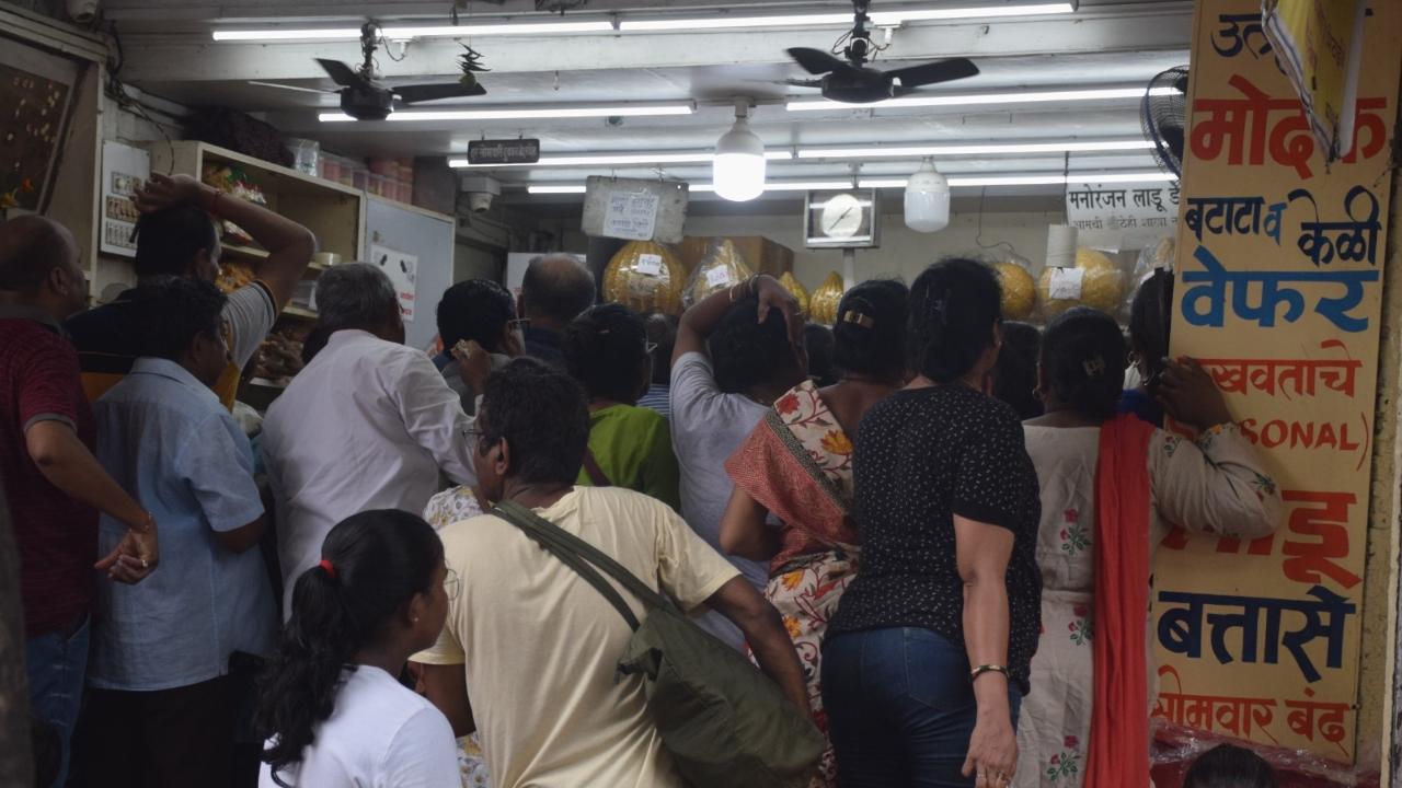 People crowd in a sweet shop at  Dadar (W) in order to buy sweets ahead of the 10-day Ganpati festival