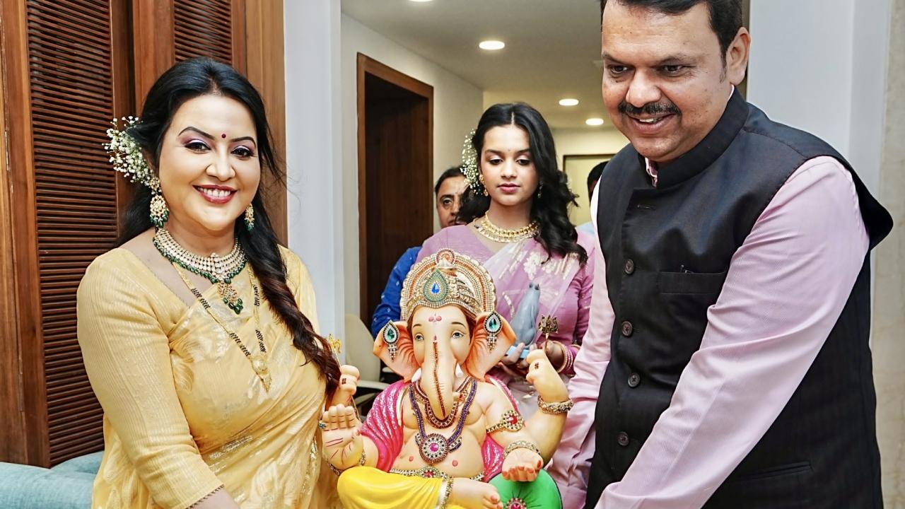 Maharashtra deputy CM Devendra Fadnavis, along with his wife and daughter, welcomes Lord Ganesha at his official residence in Mumbai
