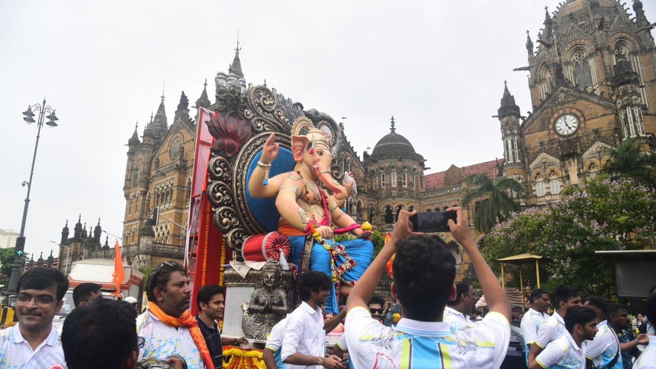 IN PHOTOS: Ahead of Ganeshotsav festival, devotees carry Lord Ganesha idol 