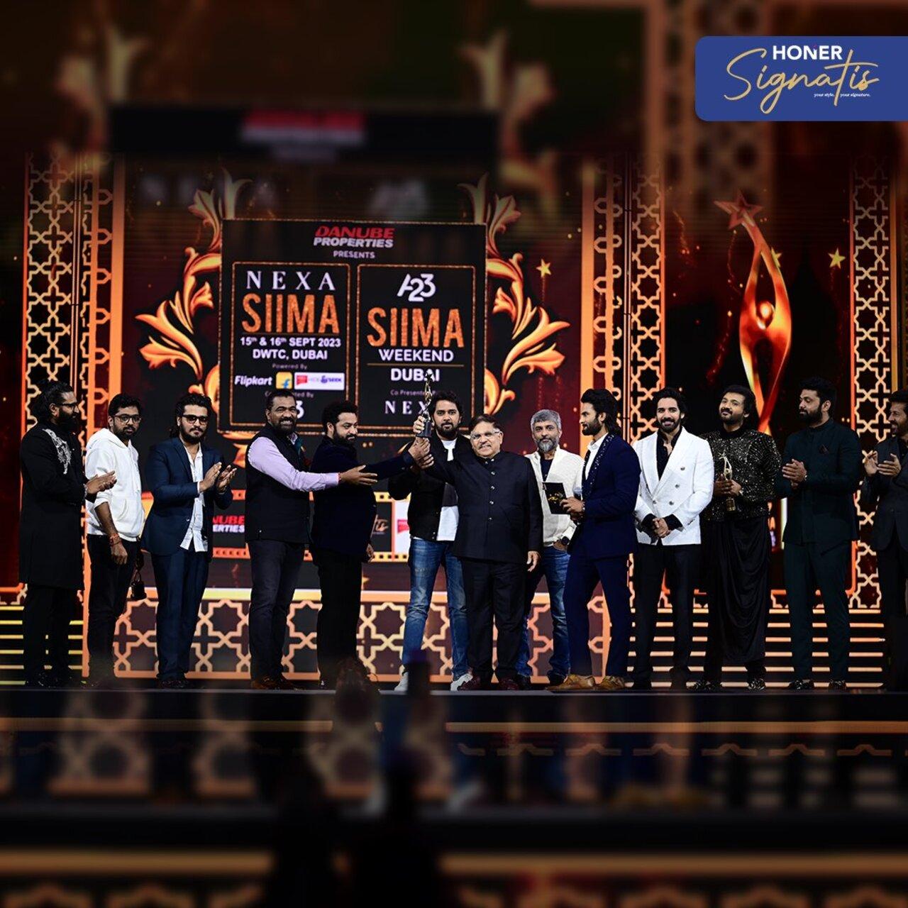 A heart-warming moment at #SIIMA2023! Stars of South Indian cinema came together on stage to honor @ssrajamouli Garu with the Best Director Award for RRR, which once again took South Indian cinema to the global level