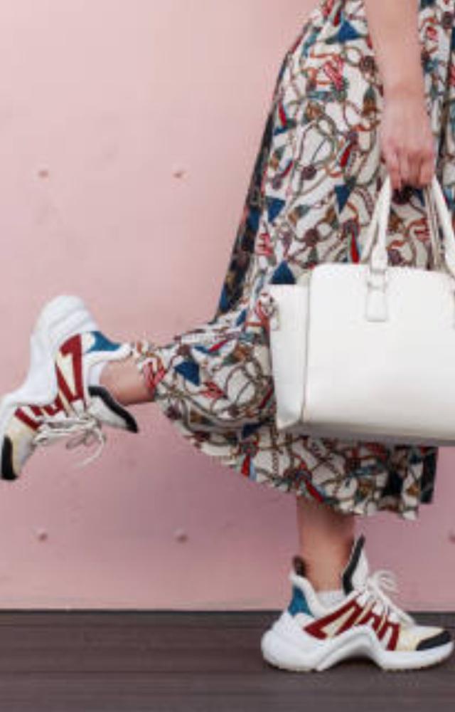 Try wearing white or patterned sneakers with flowy dresses. To complete the look, you can wear dainty jewellery
