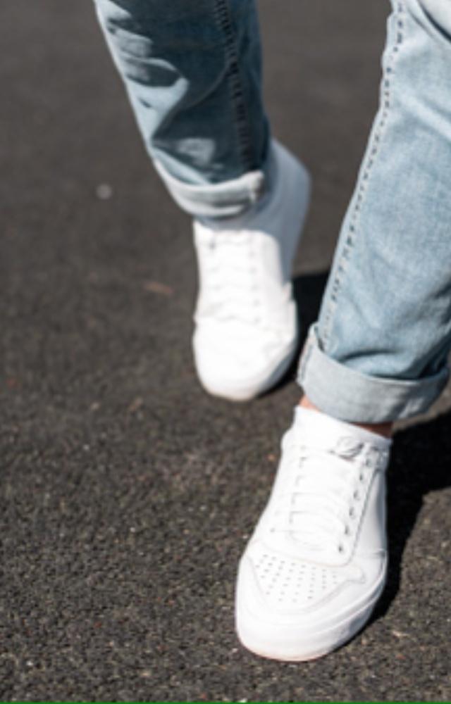 Pair white or black sneakers with casual jeans and a T-shirt. For a more defined look, wear a pair of high-top sneakers