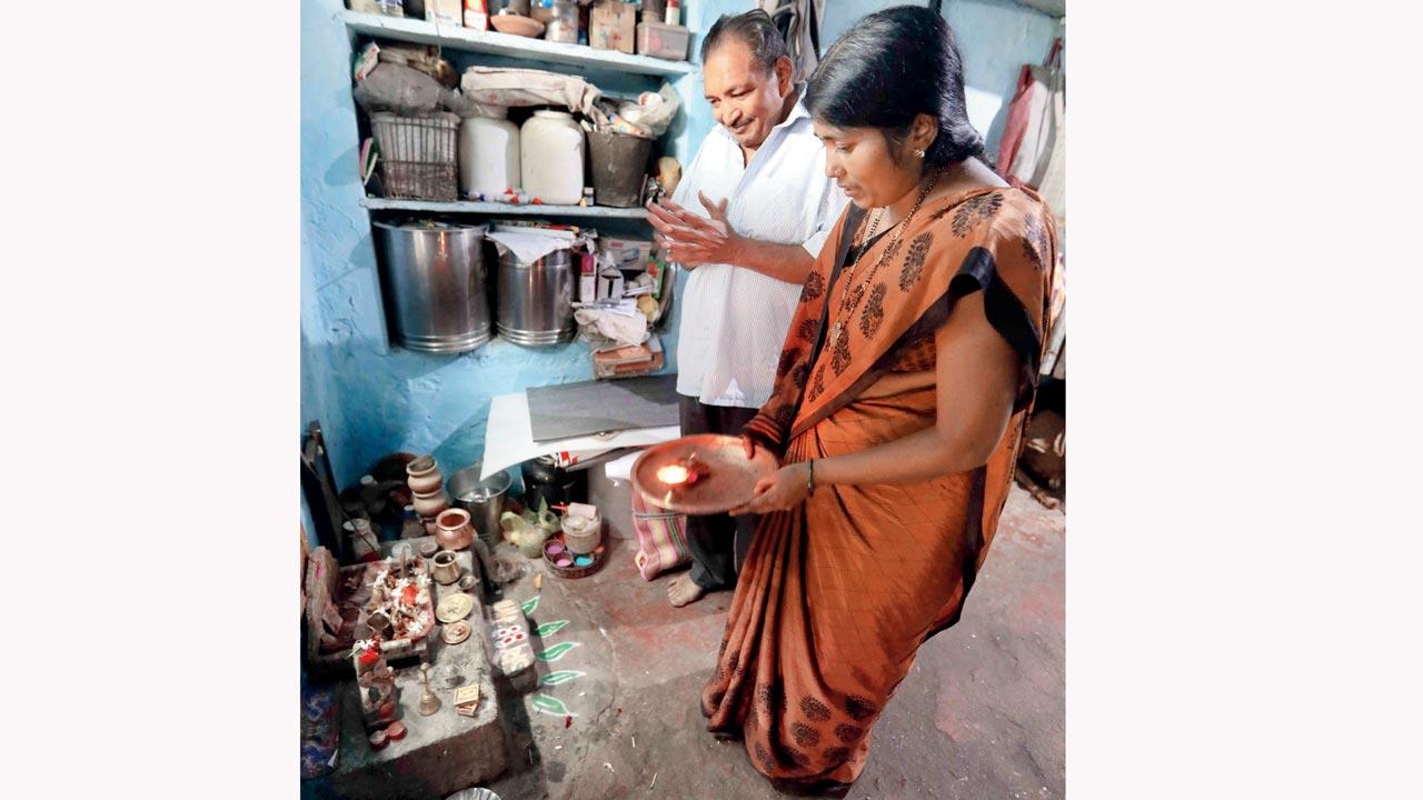 Chandrashekhar, 54, and Manisha doing Ganpati puja at their home 