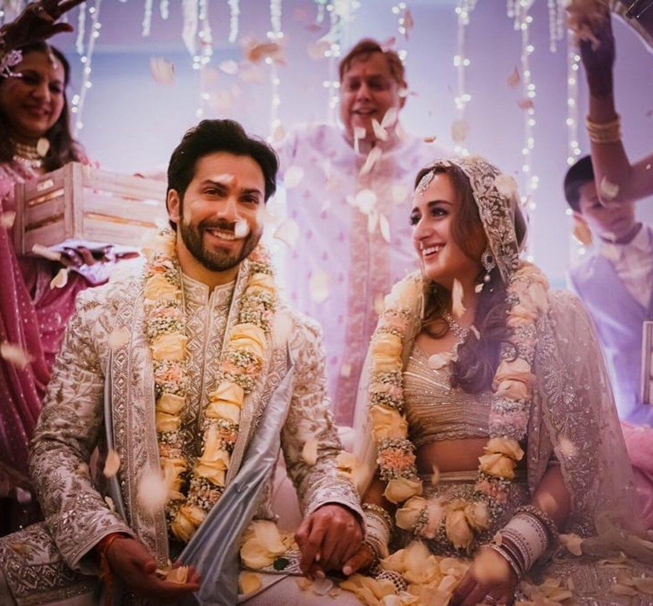 Varun Dhawan's bride, fashion designer Natasha Dalal, opted for a pastel embroidered lehenga for the big fat Punjabi wedding