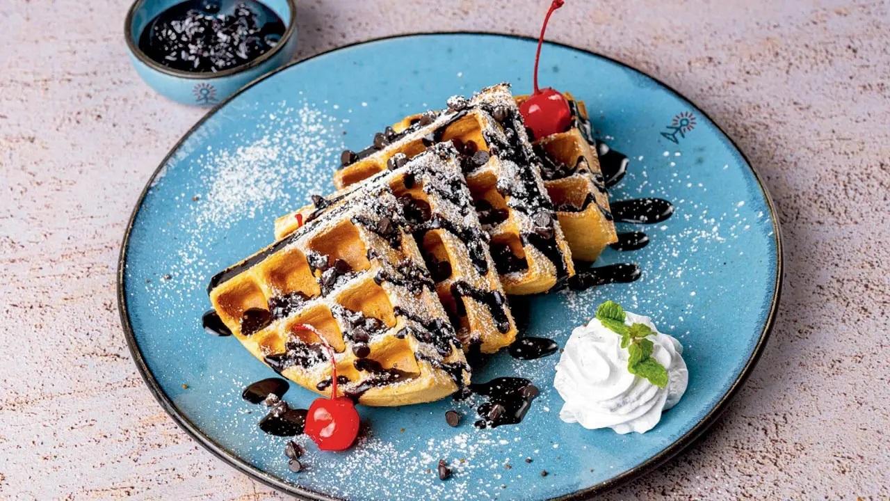 Inspired by the classic childhood favourite black forest pastry, this black forest waffle is a classic deep pan waffle. It is served with cream, cherries, chocolate ganache, chocolate chips and shavings, and a seasonal fruit compote. Smoke House Deli At 462, High Street Phoenix, Senapati Bapat Marg, Lower Parel (available at all outlets). Call 9152017981Cost Rs 425