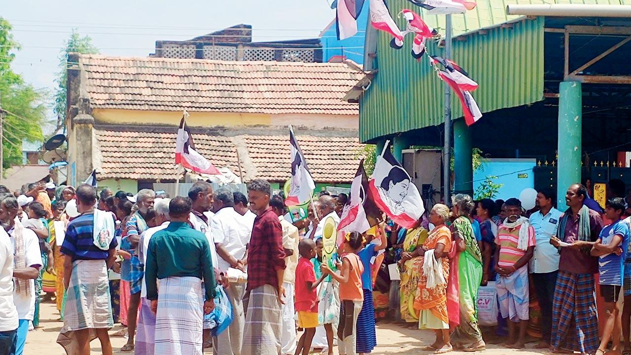 Villagers assemble and await the arrival of ex-CM O Pannerselvam at Keelathuval, Ramanathapuram, on Sunday