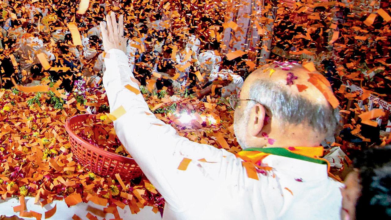 Union Home Minister Amit Shah during a roadshow. Pic/AP