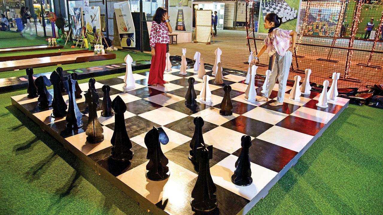 Kids play chess on a giant chessboard in Zone B. Pics/Nimesh Dave