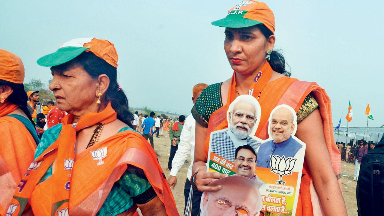 BJP supporters during a public meeting of PM Modi