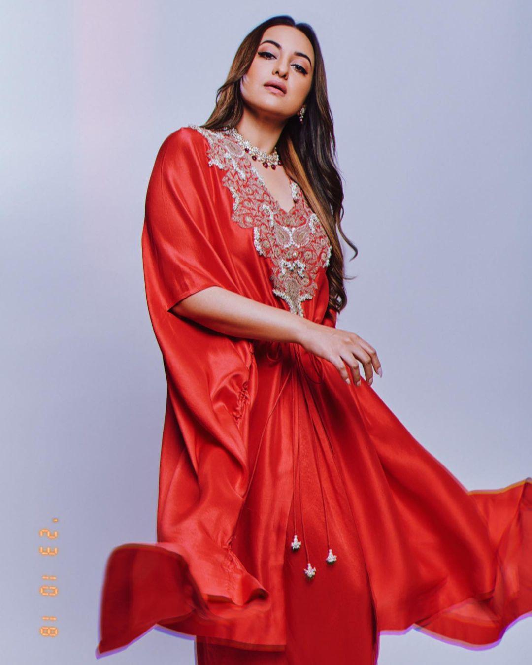  In this look, the actress wore a striking red-colored kurta with stylish dhoti-style bottoms, which struck a balance with ethnic and modern glam