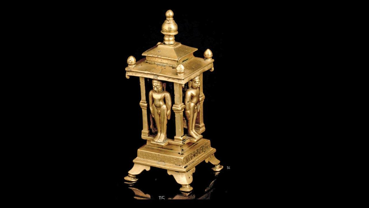A brass Jain Chaturmukha shrine from the Western Deccan, dated 1530 BC, representing the Nandisvara island where, according to Jainism, the Gods celebrate sacred festivals. It depicts a Digambar Tirthankara figure on each side