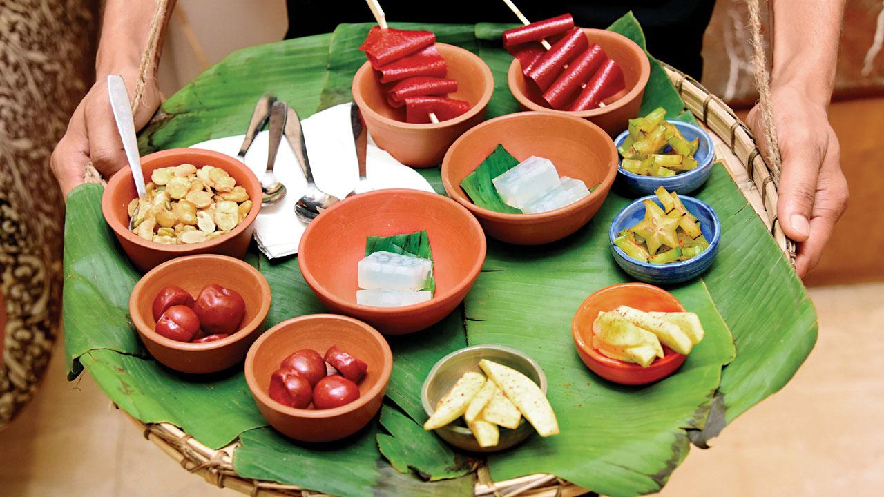 During festivities, vendors sell budhi chow (bottle gourd fritters), plum rubber, slivers of raw mango, star fruit and tangy marian plum or plum mango on the streets