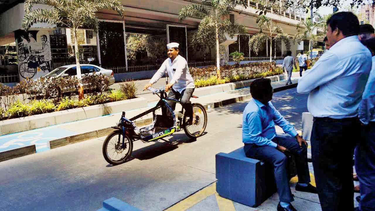 A dabbawala test drives the cargo e-bike during a trial run 