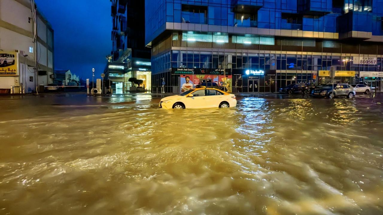 Vehicles were stranded on flooded streets following heavy rains in Dubai. Pics/AFP