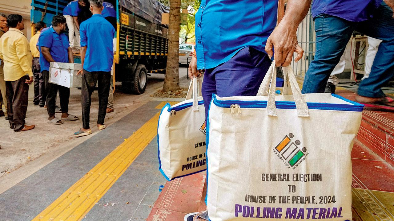 An election official during the distribution of EVM and other polling material on the eve of the first phase of Lok Sabha elections. Pic/PTI