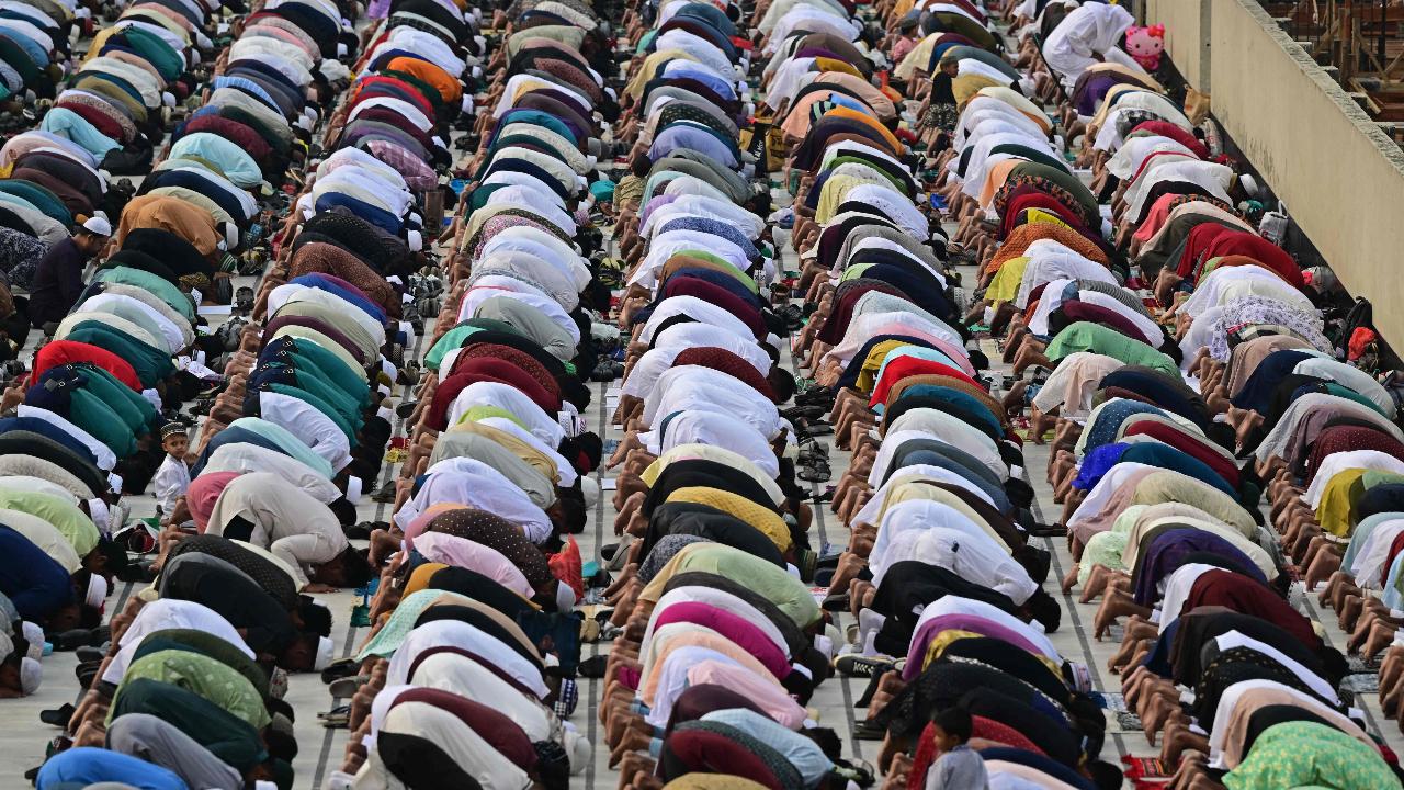 Muslim devotees offer Eid al-Fitr prayers, which marks the end of the holy fasting month of Ramadan in Dhaka.