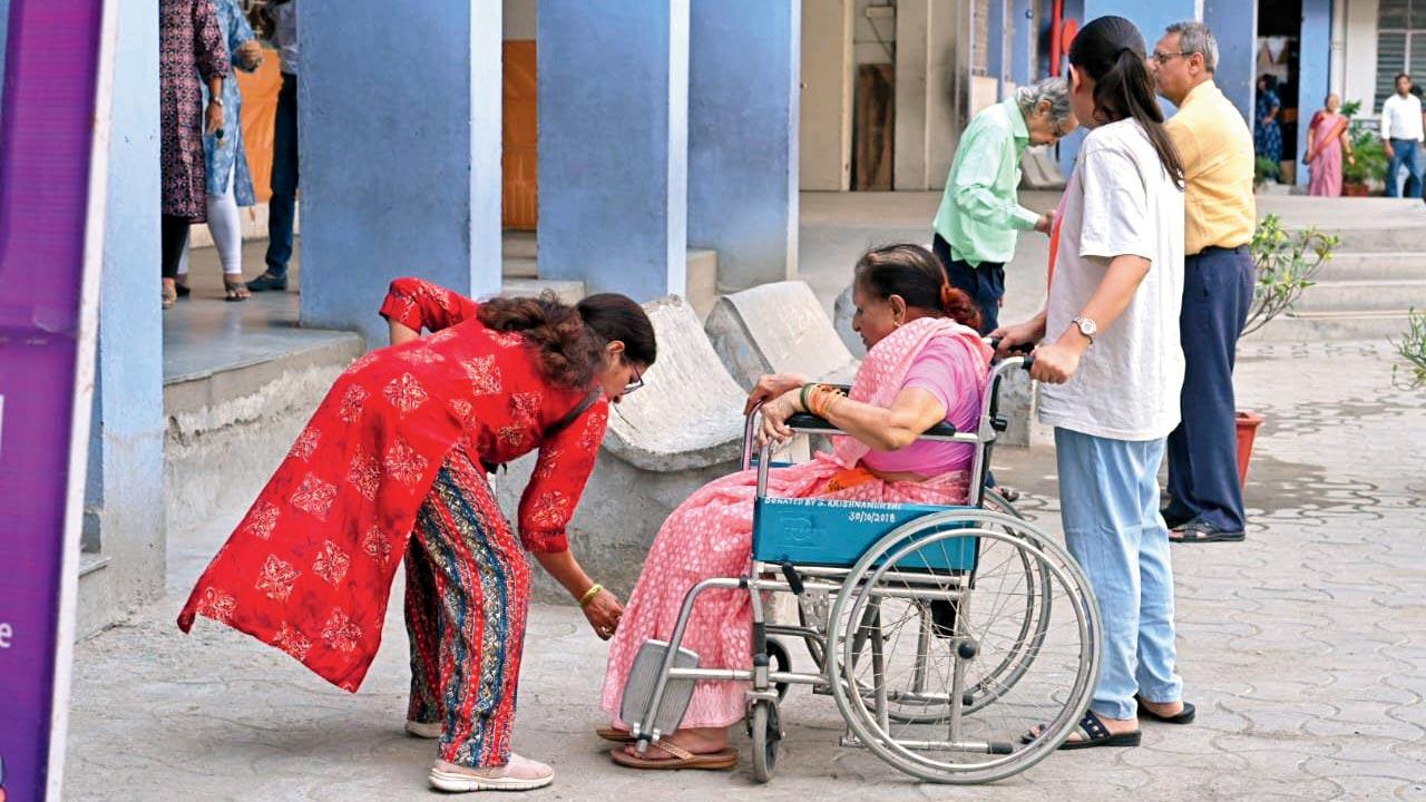 Senior citizen coming to vote in a wheelchair in Vidarbha. Pic/X