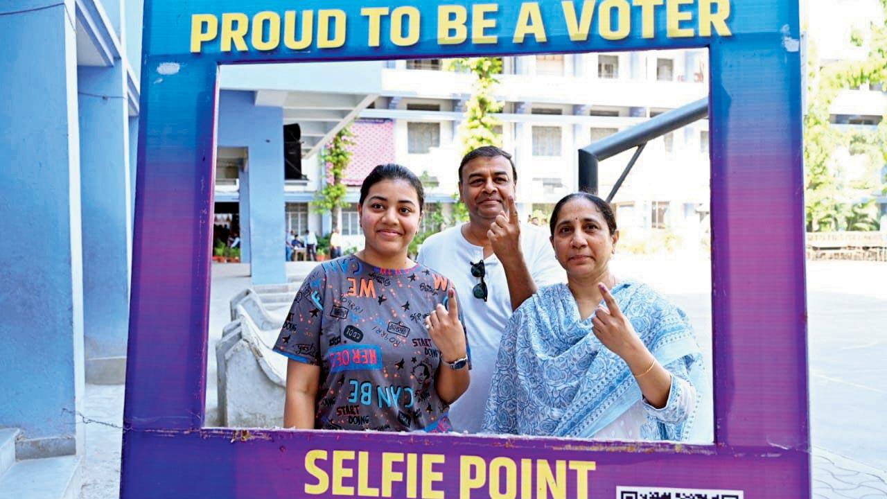 Voters pose at selfie point after voting in Vidarbha. Pic/X