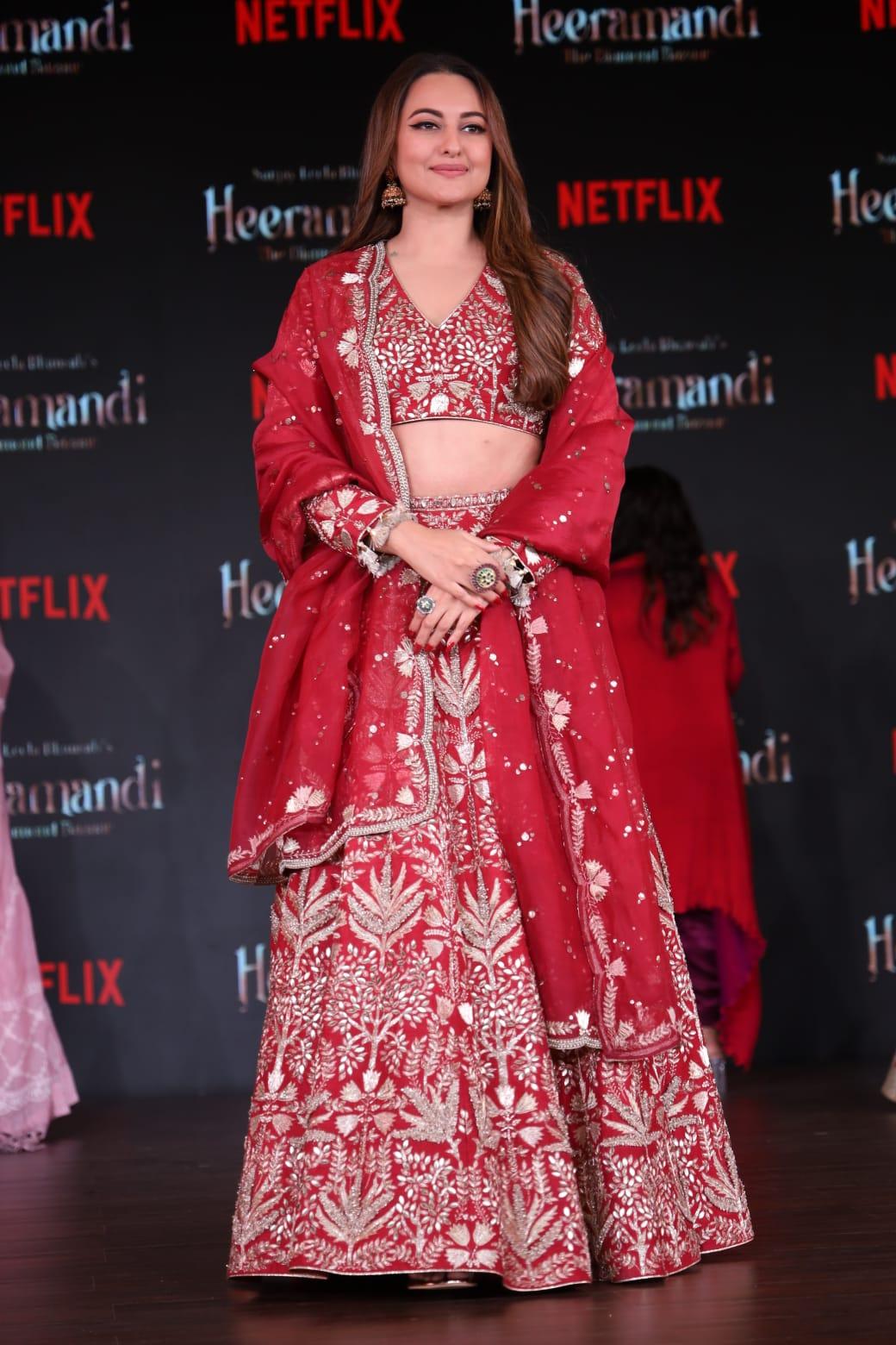 Sonakshi Sinha, who will be seen in a shady grey character in the series, was seen wearing a red embroidered lehenga at the event
