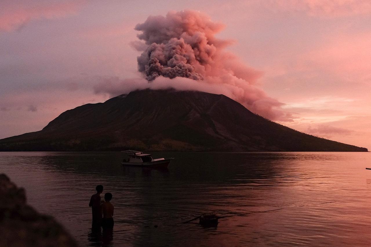 Indonesia's Disaster Management Agency lowered the volcano's alert level from four, the second-highest level, to three, but said residents were still ordered to remain at least 4 kilometers (2.7 miles) away from the mountain
