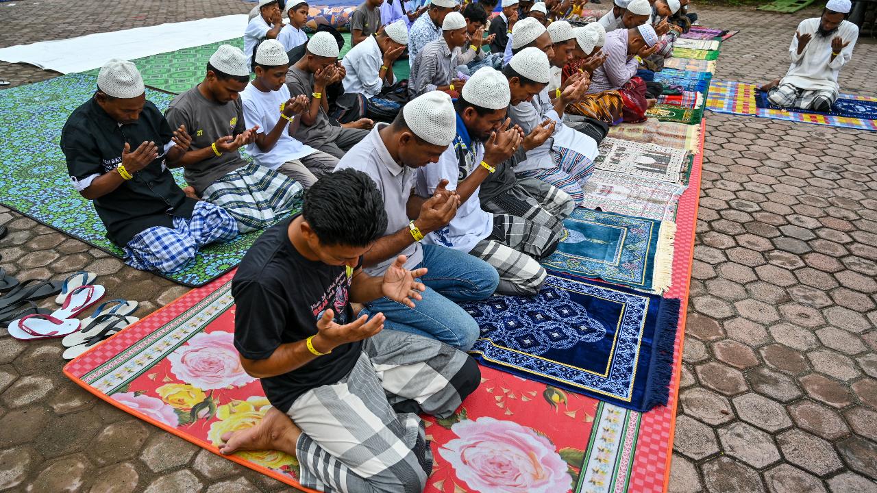Rohingya refugees take part in Eid al-Fitr prayers, marking the end of the holy month of Ramadan, at a temporary shelter in Indonesia's Aceh province in Meulaboh.