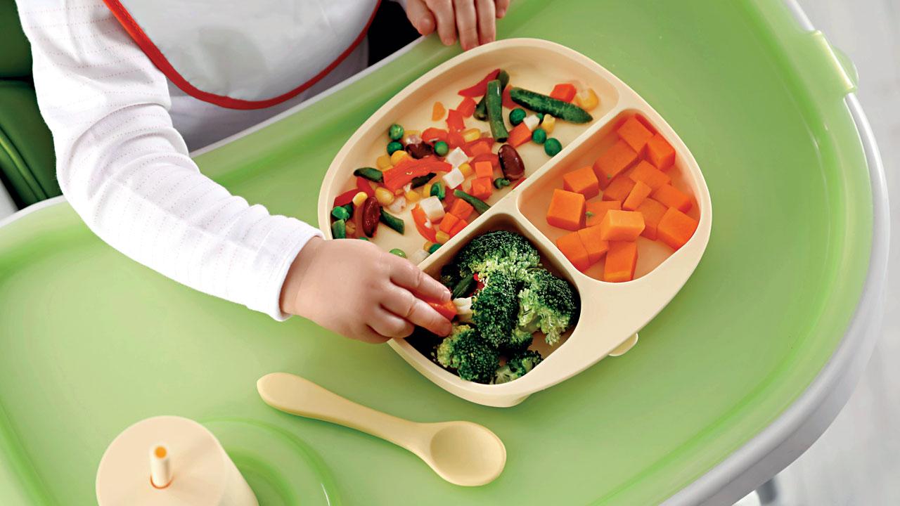 Gradually introduce the baby to boiled and puréed vegetables or fruit in the first year. REPRESENTATION PICS