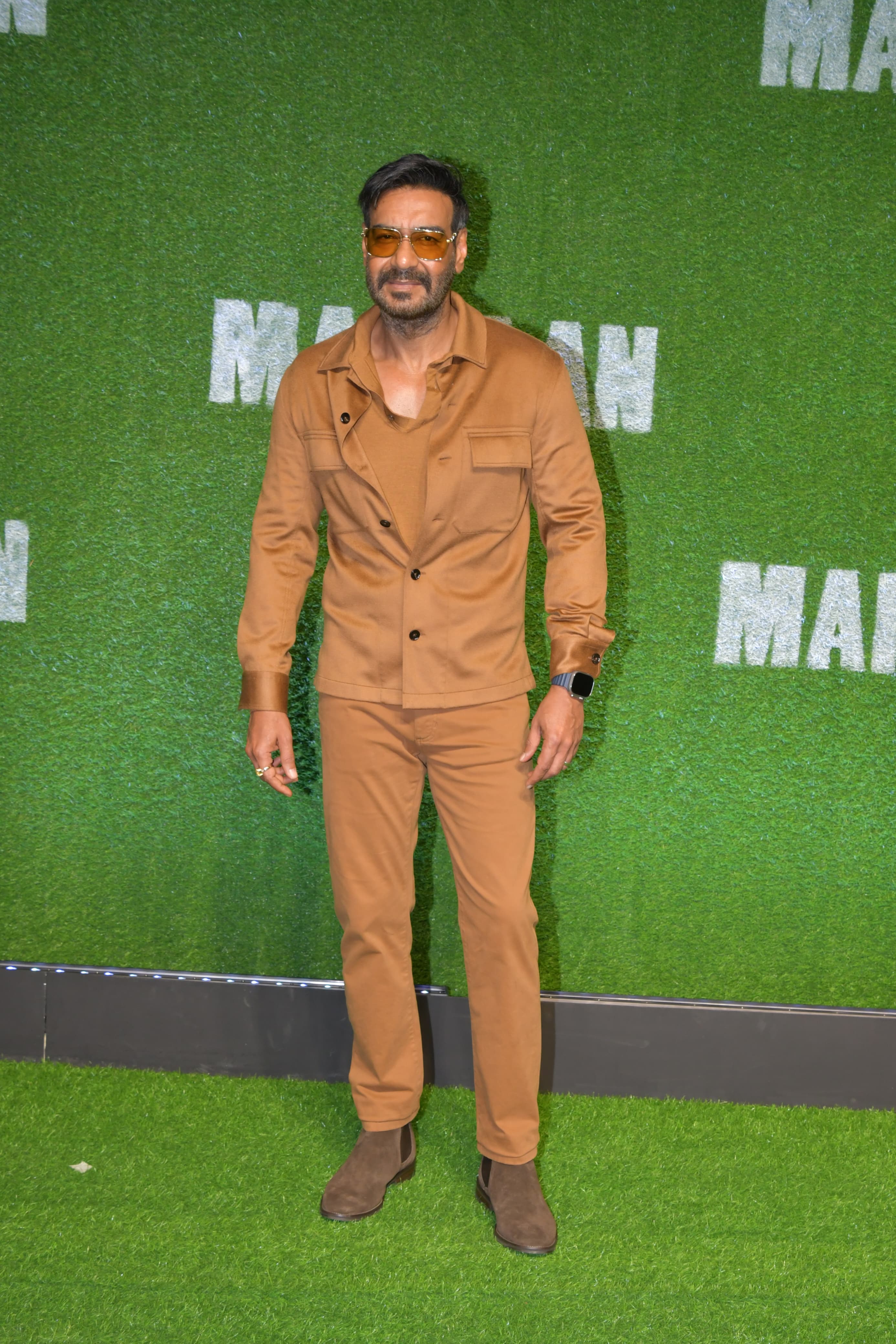 Ajay Devgn pose for the paparazzi as he attended the screening of his upcoming biographical sports drama 'Maidaan'