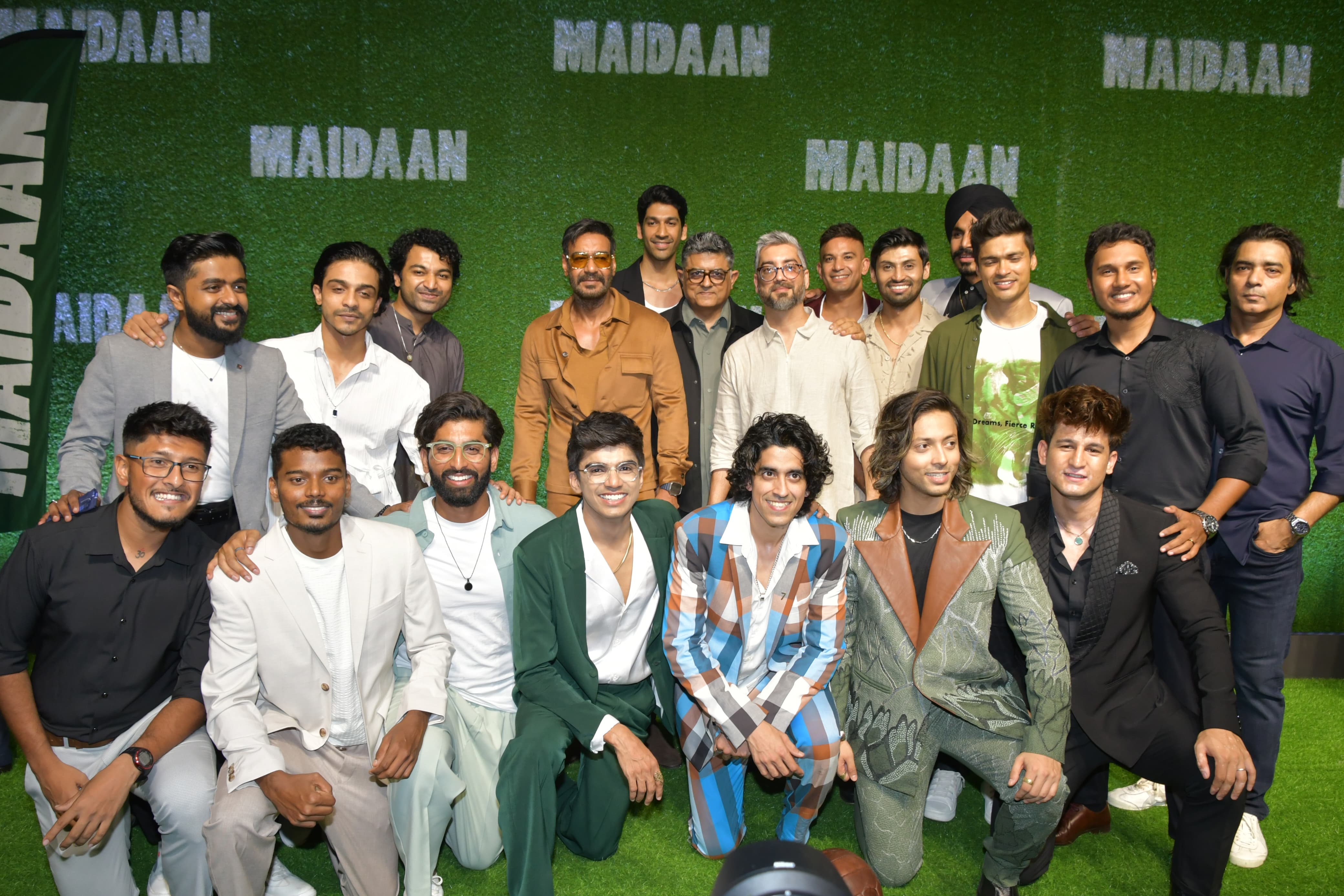 Ajay Devgn was snapped on the green carpet of the Maidaan screening as he posed with the entire cast of the team