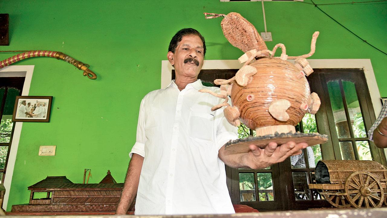Sreekumar P’ with his model of the COVID-19 virus. Pic/Atul Kamble
