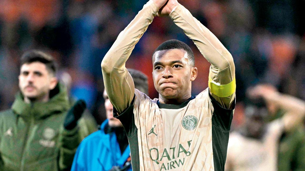 Kylian Mbappe acknowledges the cheers after PSG’s victory