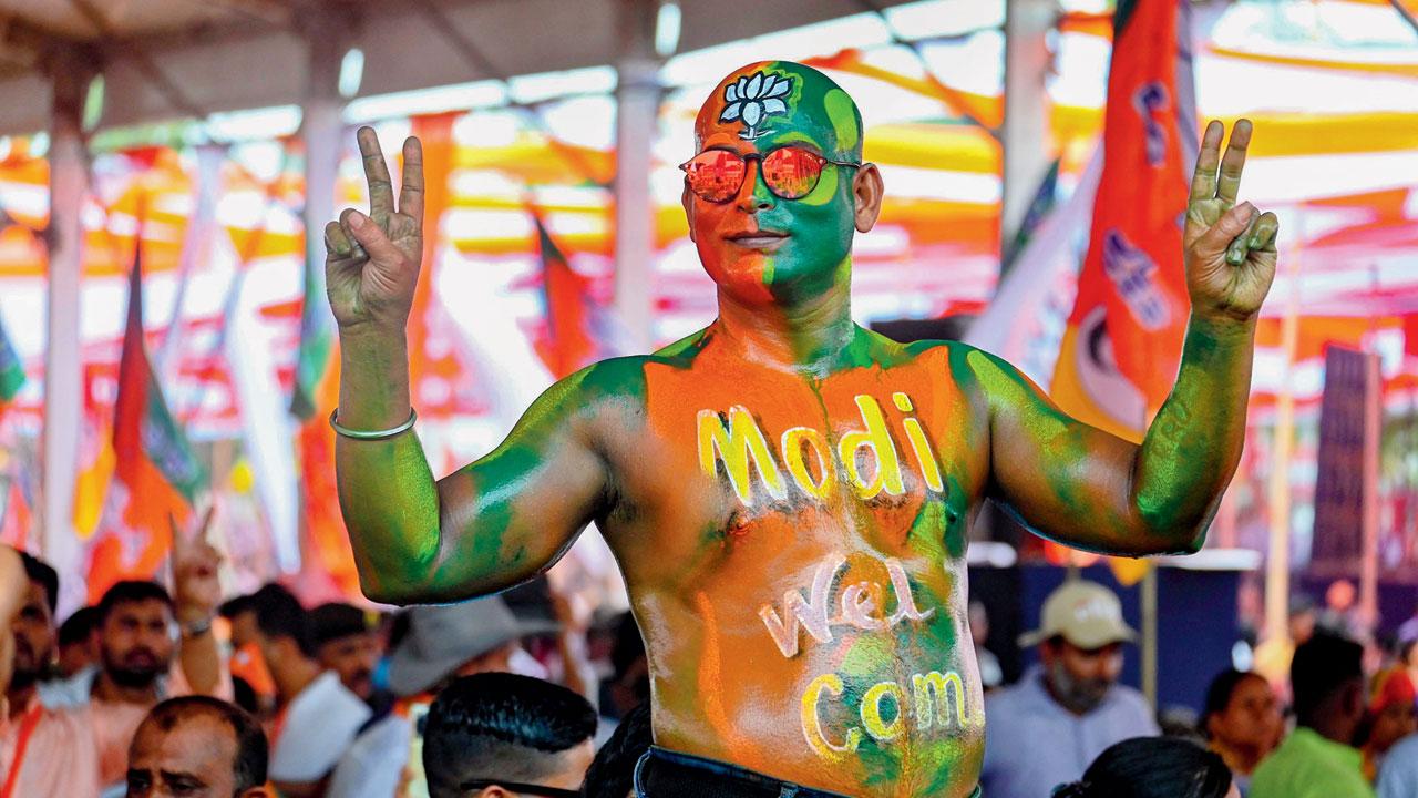 BJP supporter during a public meeting of PM Narendra Modi. Pic/PTI