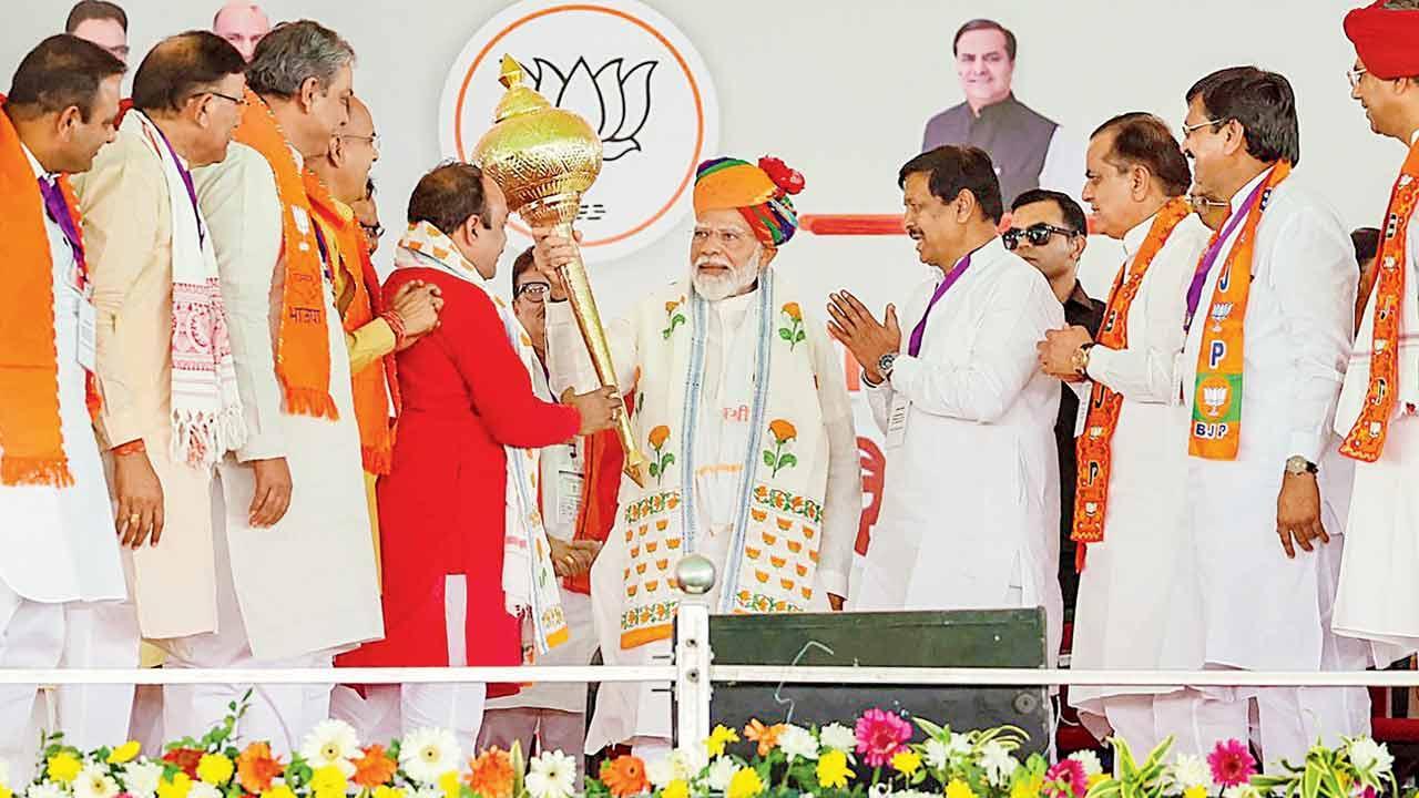 PM Modi being felicitated by BJP leaders during in Tonk district, Rajasthan. Pic/PTI