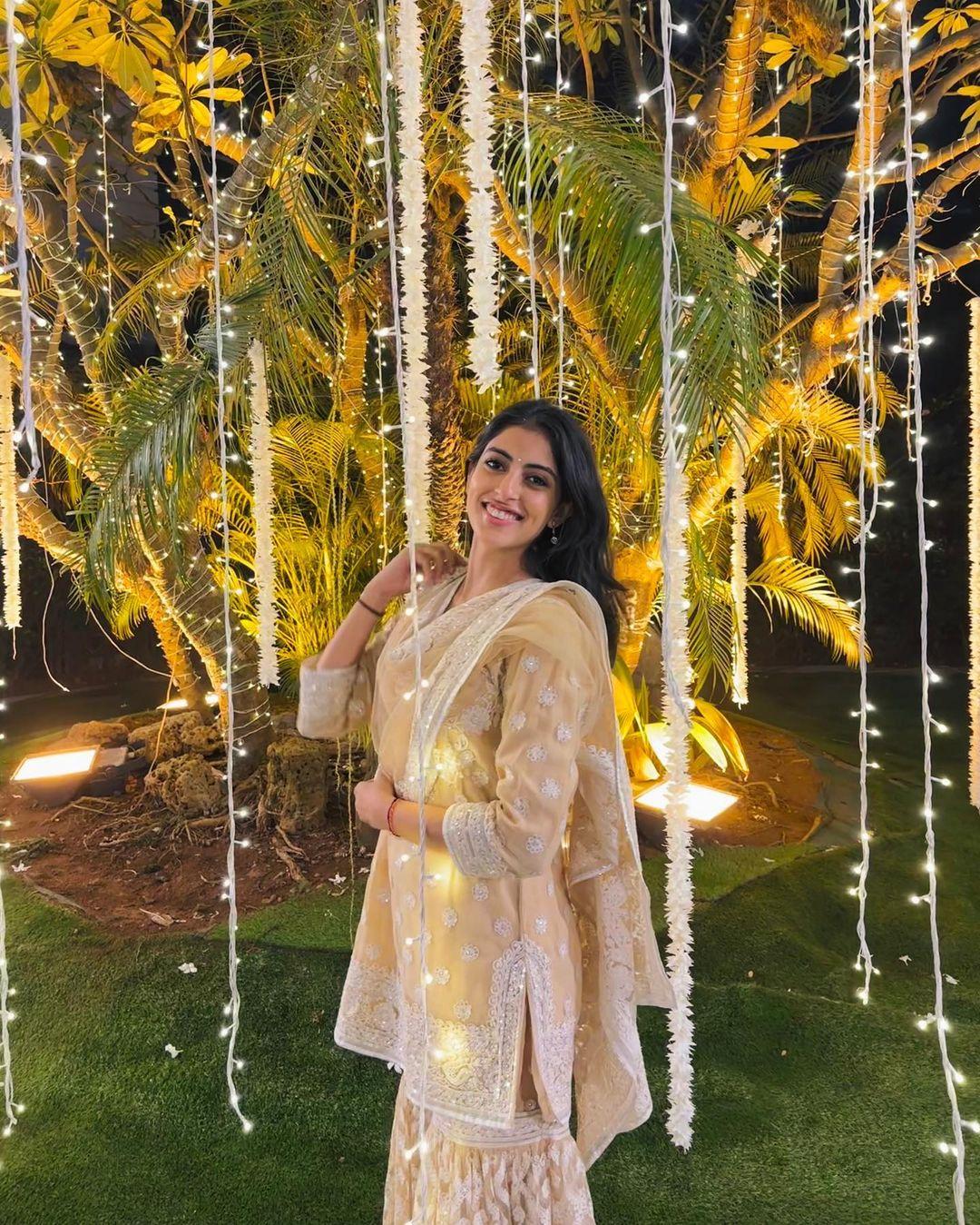 Don't want to wear a heavy saree? Worry not, Navya's wardrobe has options for you as well. In this pretty princess look, she wore a beautiful light yellow-colored chikankari suit paired with matching palazzo pants and dupatta
