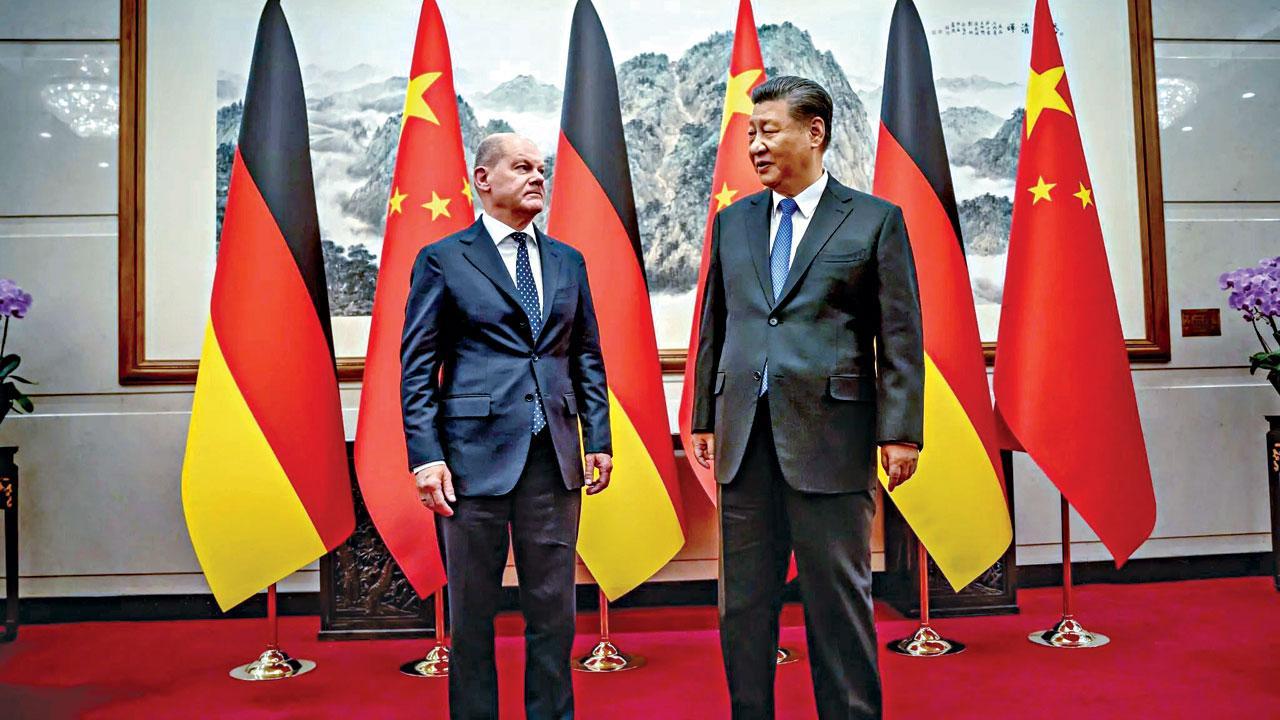 German Chancellor Olaf Scholz (left) with Chinese leader Xi Jinping in Beijing. Pic/X