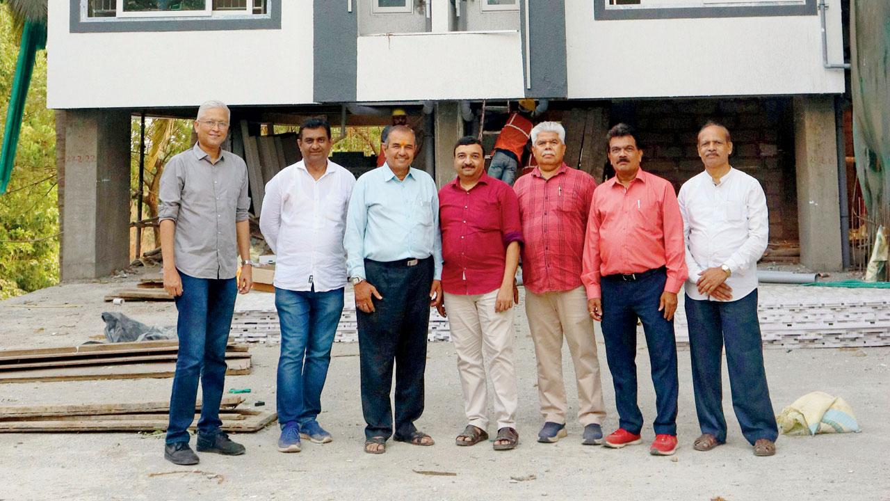 (From left to right) A photo of the redevelopment committee members, including Rakesh Gaikwad, Advocate Datta Kumthekar, Balkrishna Dhumne, Prabhakar Kuado, Anil Harkar, Milind Mahadik, and Manohar Bugade