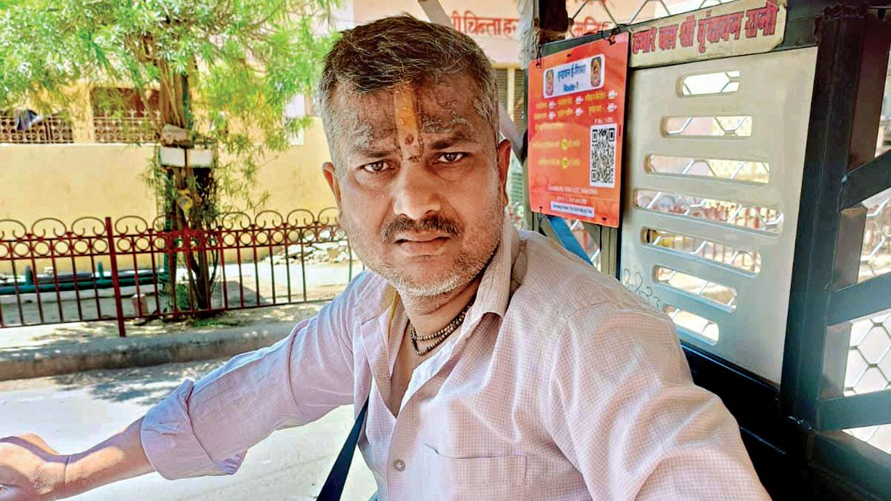 Pushkar Upadyay, an-e-rickshaw driver who visited Vrindavan and decided to stay there with his family