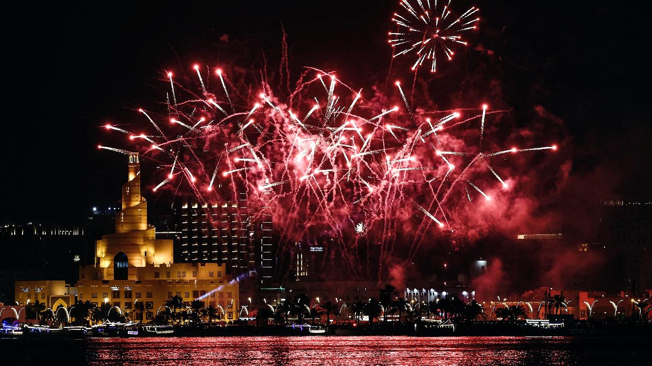 Fireworks light up the sky over the Fanar Mosque with its spiral minaret by the Doha Corniche during celebrations on the first day of the Muslim holiday of Eid al-Fitr after the end of the holy month of Ramadan.