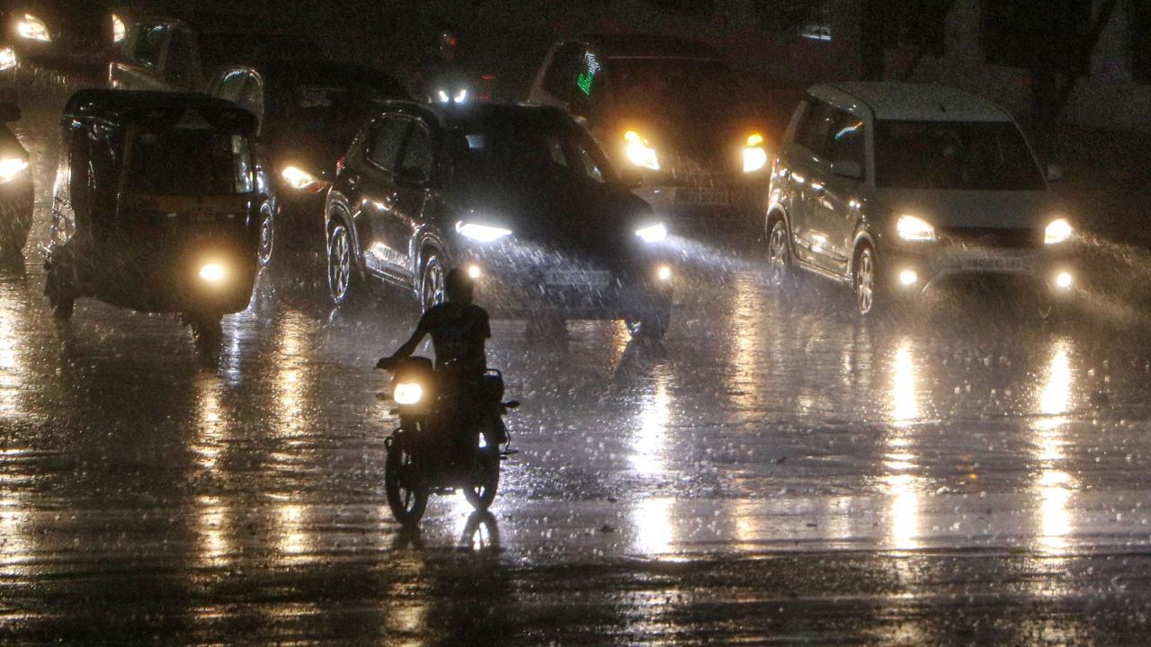 Vehicles ply during heavy rains in Maharashtra`s Nagpur. Pic/PTI