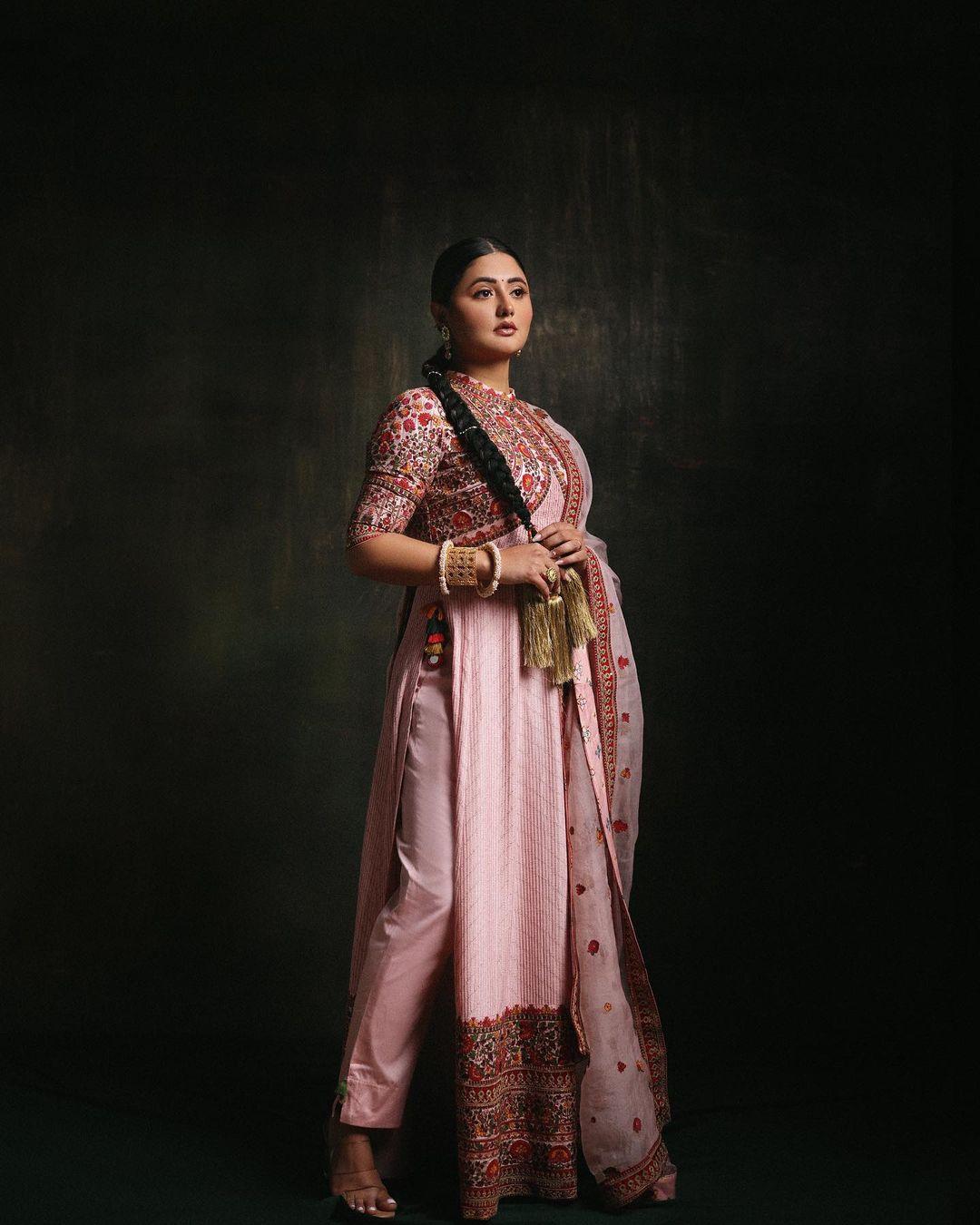 In this stunning traditional appearance, Rashami Desai captivates in a pink kurta paired with matching pants and dupatta