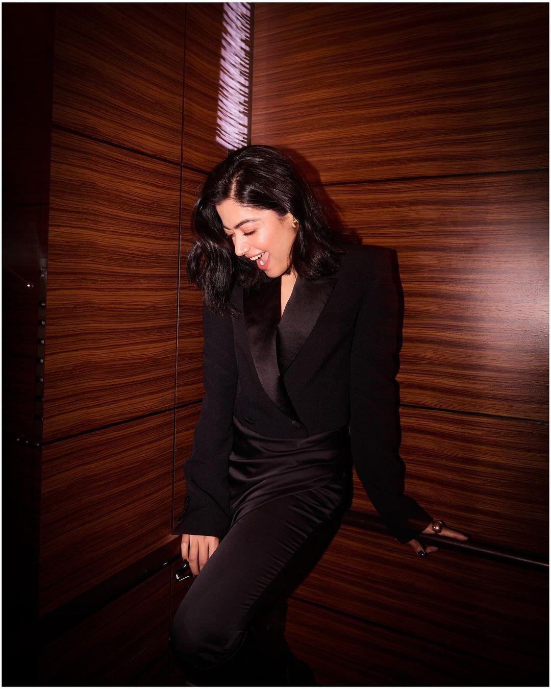 If you have an office party to attend, worry not, this one from Rashmika is a total hit. In this look, she wore a beautiful black blazer and paired it with an A-line matching skirt