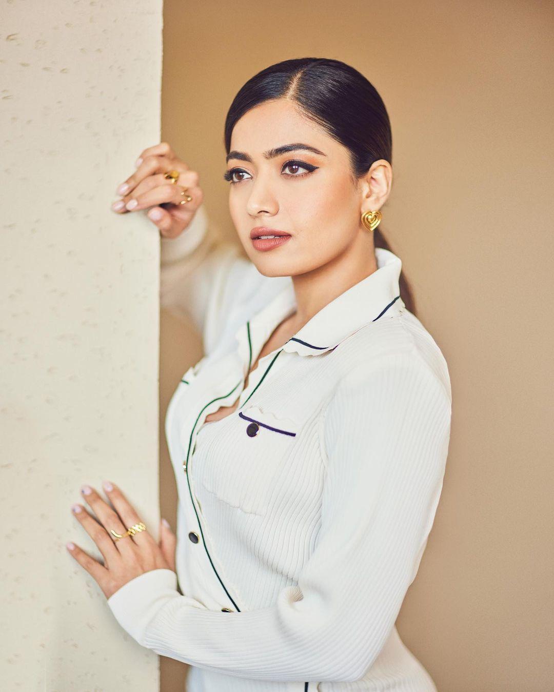 In this look, Rashmika wore a gorgeous white gown with a thigh-high slit. The actress paired her gown with beautiful yet simple sandals