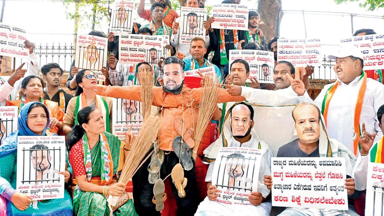 Congress supporters stage a protest