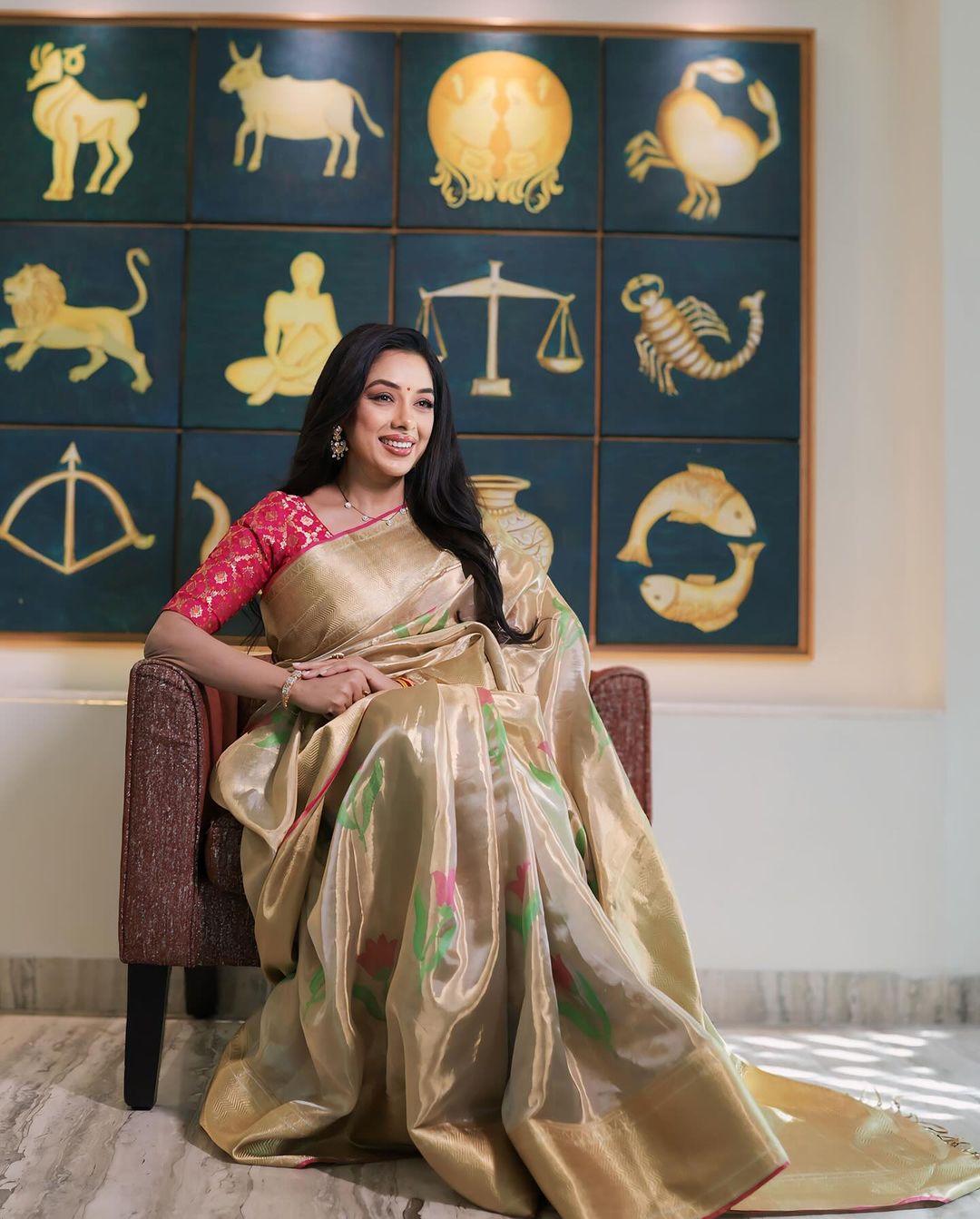 Rupali Ganguly's saree collection is the ultimate destination to find the perfect match for acing any family occasion. In this appearance, Rupali wore a stunning beige saree with lotus prints on it