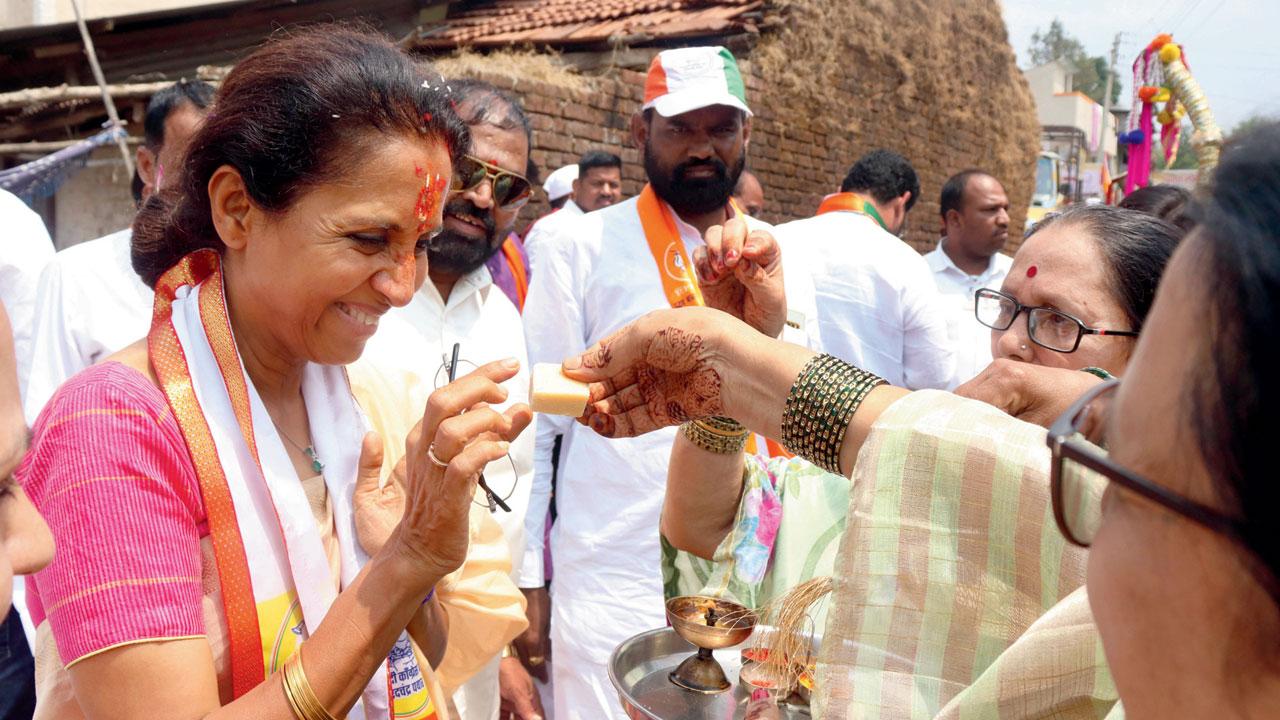 NCP (SP) candidate from Baramati Supriya Sule interacts with voters at Khadakwasla on Wednesday